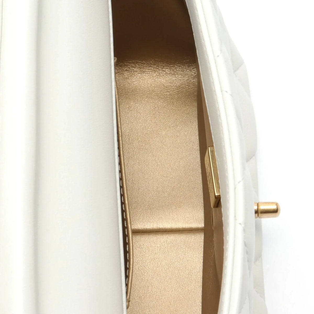 Chanel mini flap bag in white with pearl accents and gold hardware, featuring signature quilting and classic design.