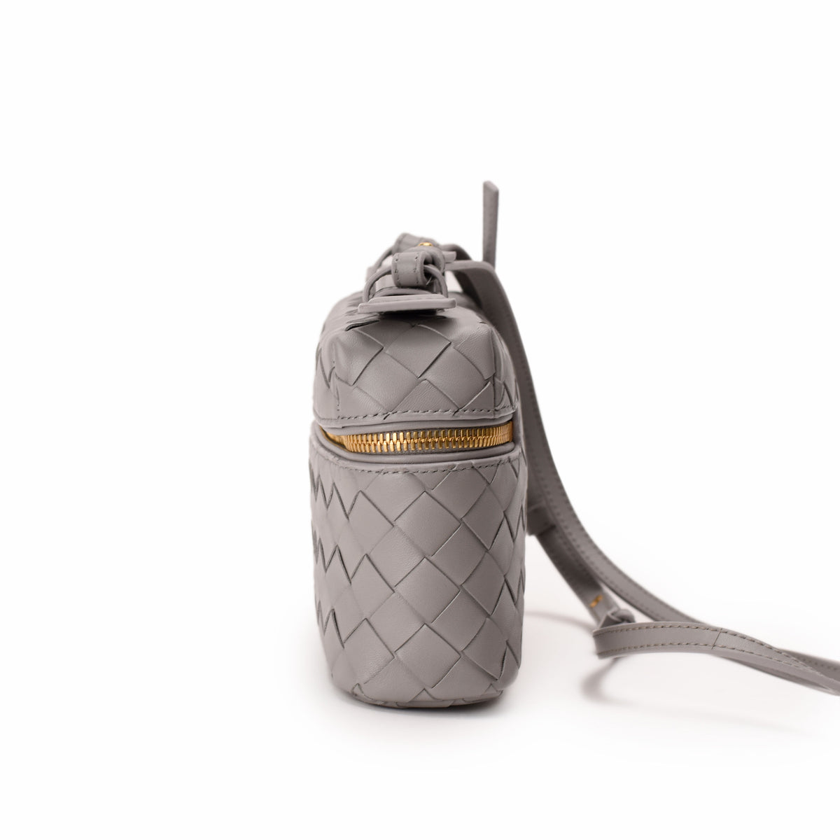Grey woven leather Bottega Veneta pouch with gold zipper, curated Pre-loved Luxury by Myluxe in Helsinki.
