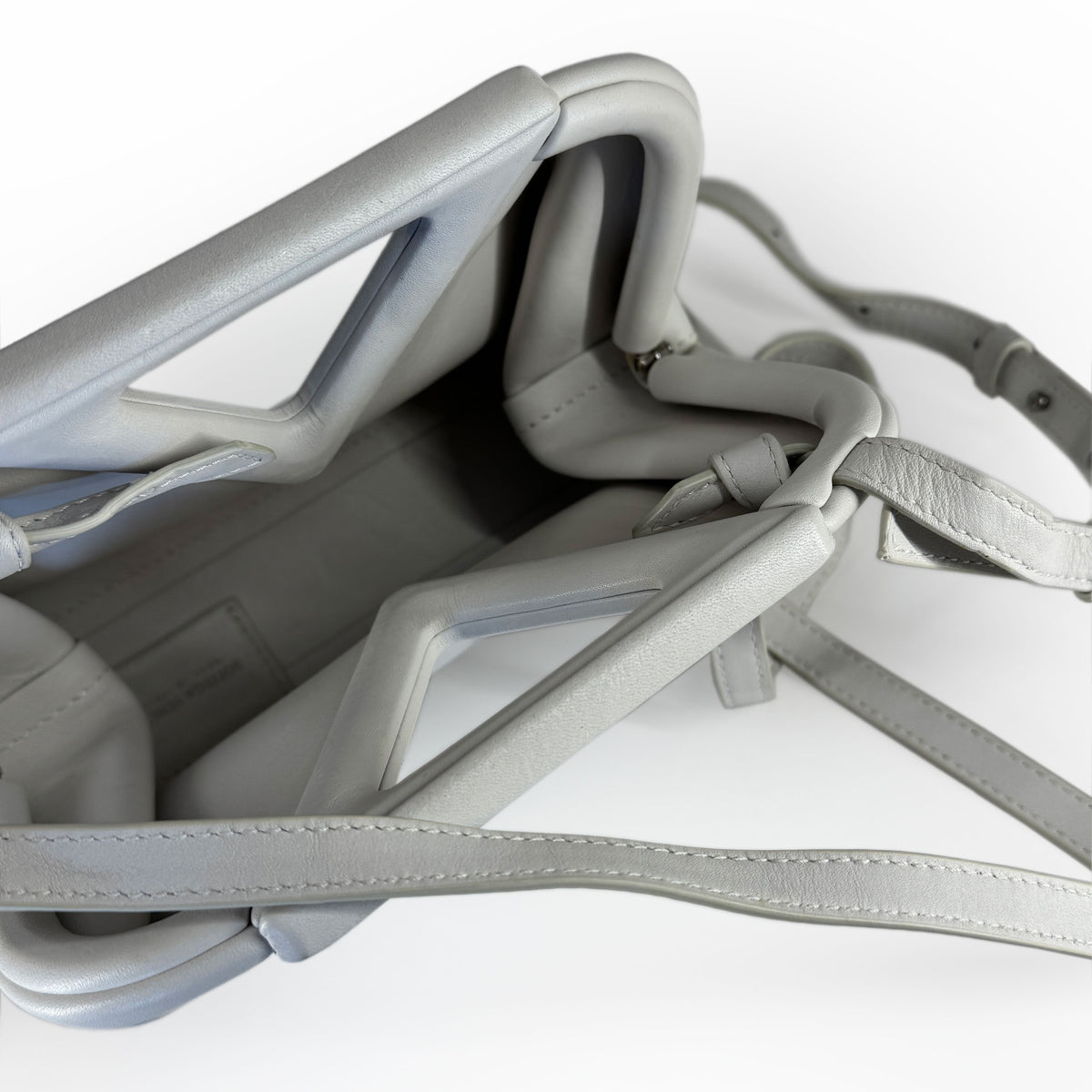 Light grey leather luxury handbag with structured handles, curated Pre-loved Luxury by Myluxe in Helsinki.