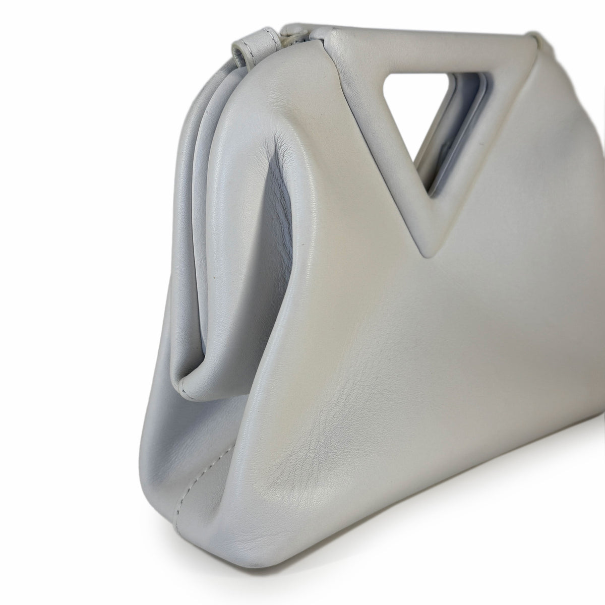 Light grey soft leather clutch bag with geometric cutout handle, curated Pre-loved Luxury by Myluxe in Helsinki.