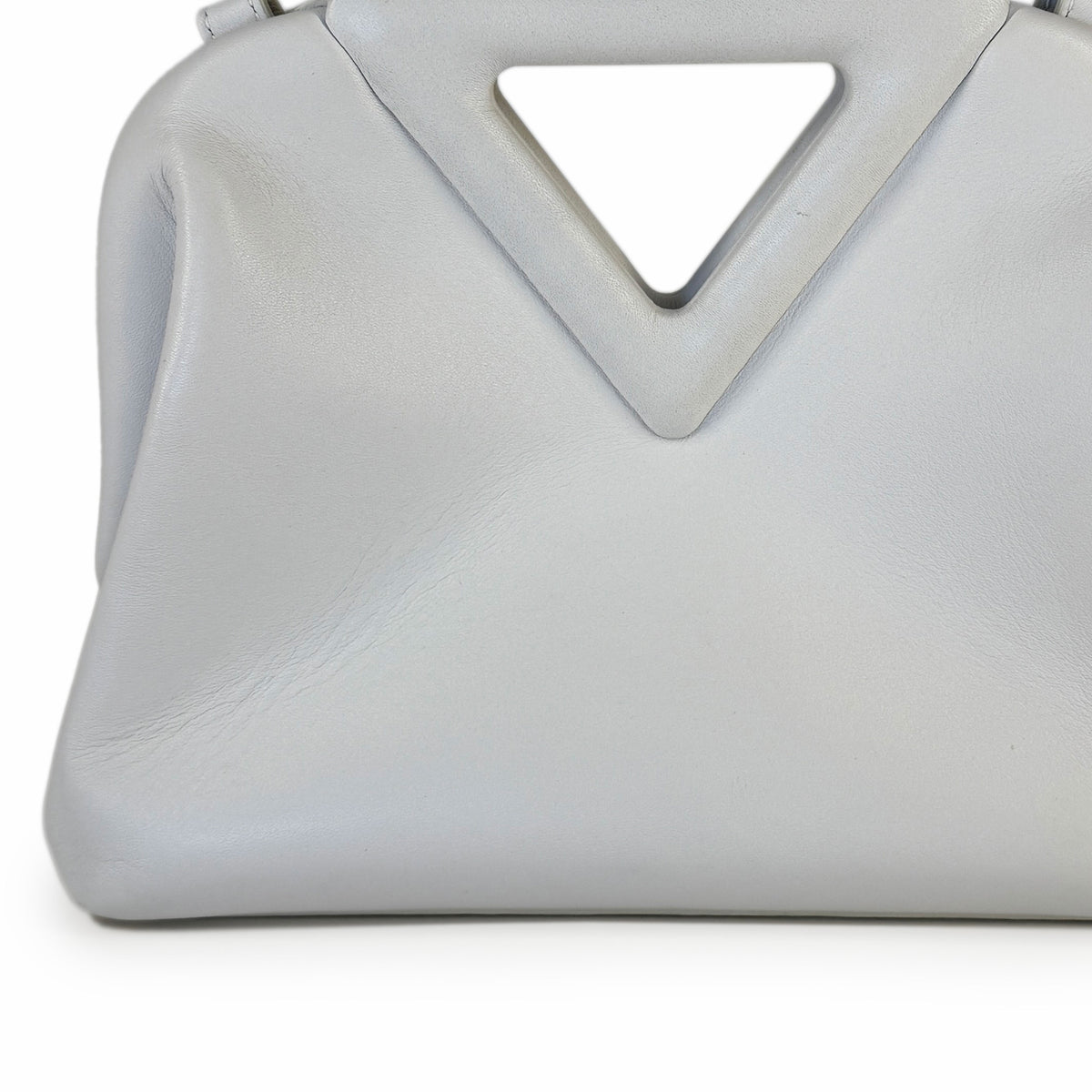 Light grey soft leather handbag with a unique geometric triangular handle, curated Pre-loved Luxury by Myluxe in Helsinki.