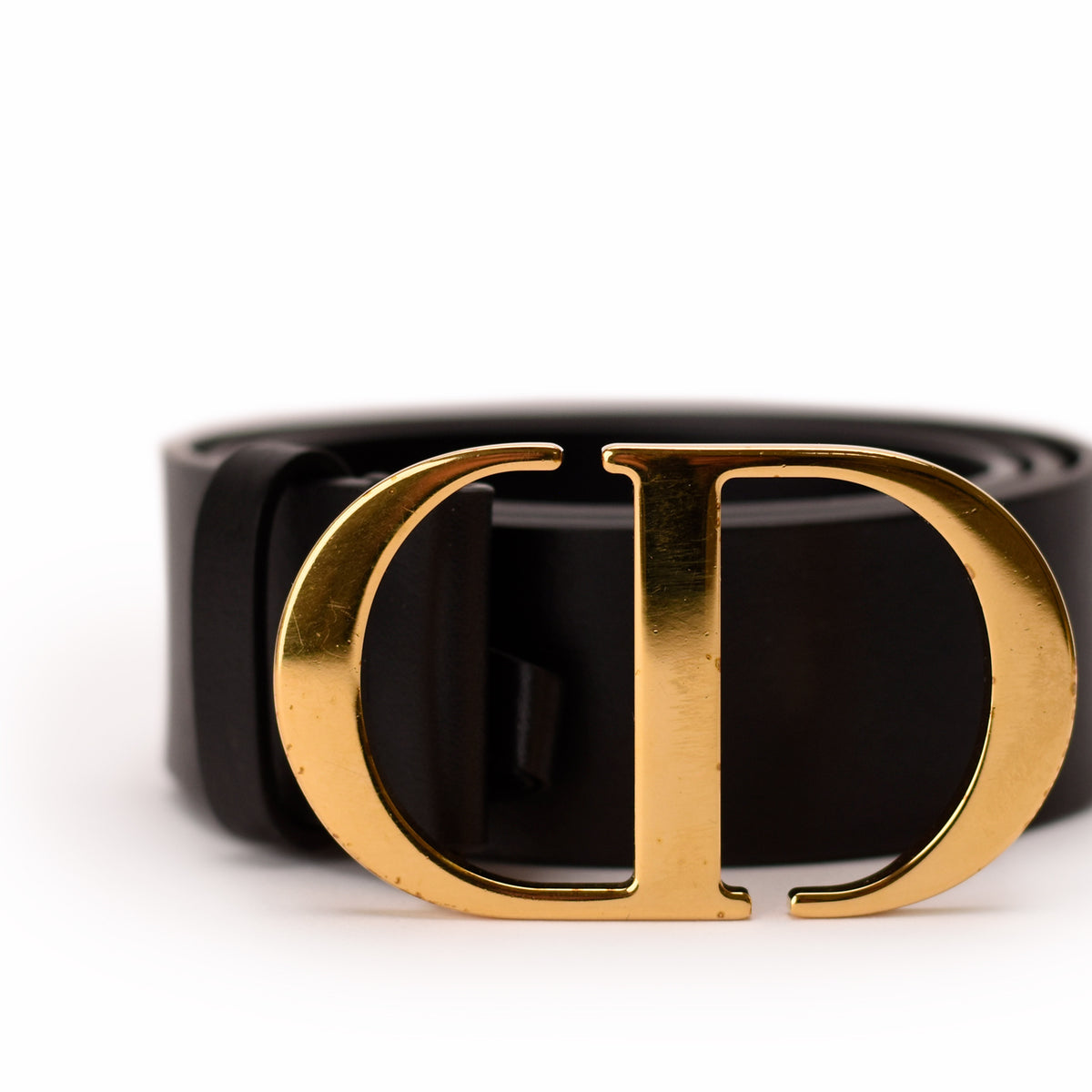 Black leather Dior belt with a polished gold-tone CD buckle, curated Pre-loved Luxury by Myluxe in Helsinki.