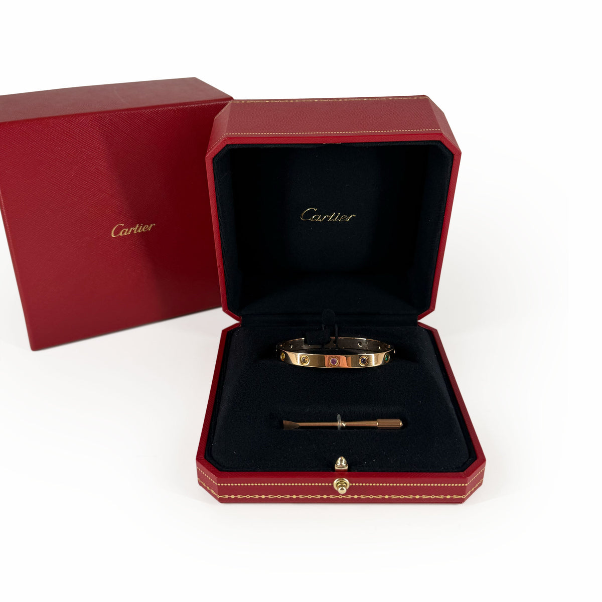 Cartier Love bracelet in rose gold with red gemstones, curated Pre-loved Luxury by Myluxe in Helsinki.