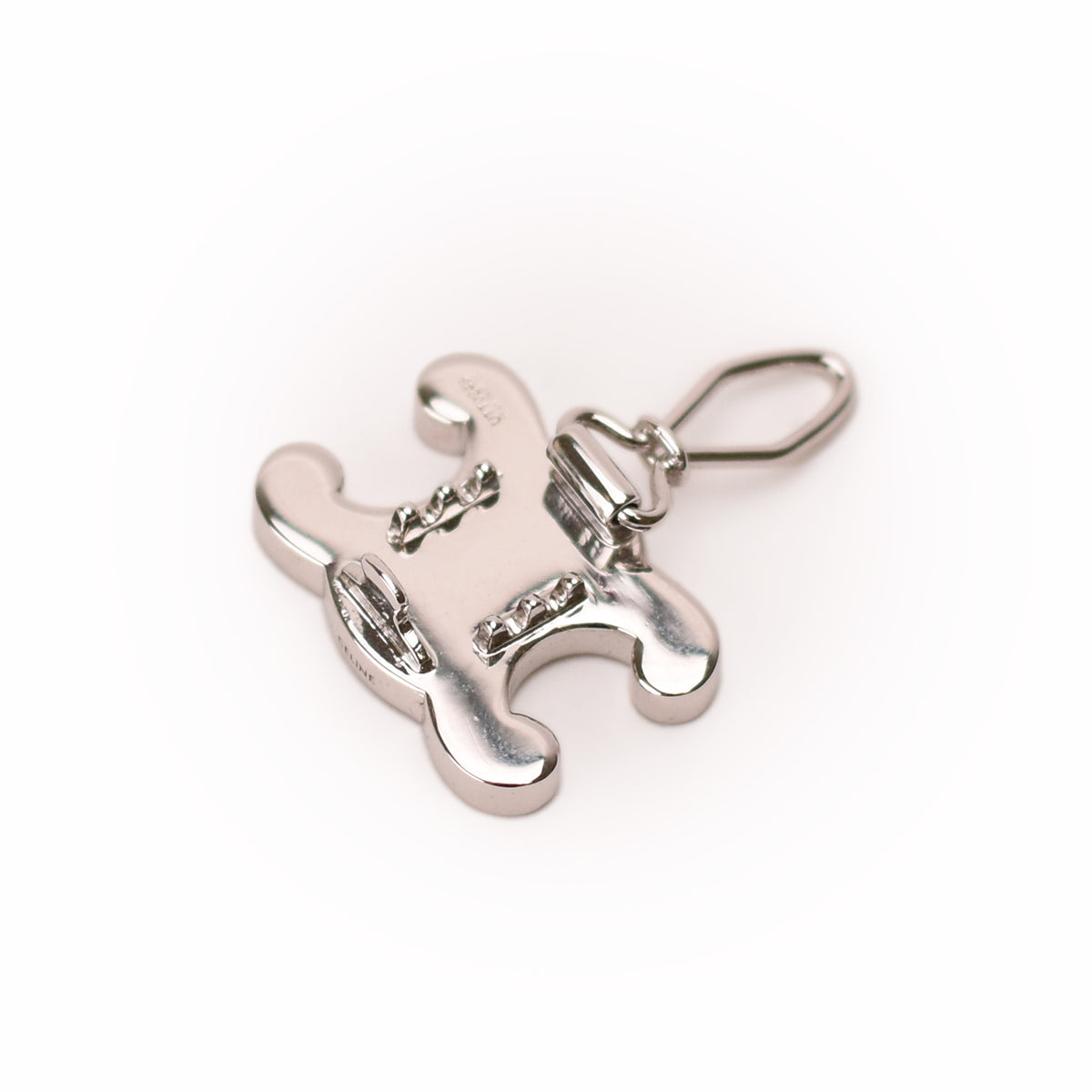 Silver-toned metallic Hermes charm with a clasp, curated Pre-loved Luxury by Myluxe in Helsinki.