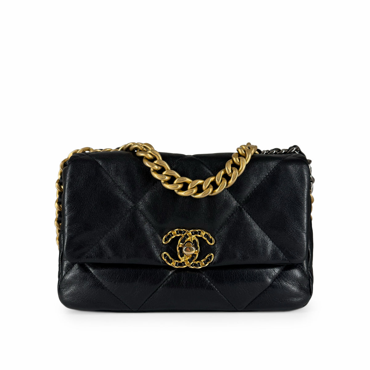 Black quilted lambskin Chanel handbag with gold-tone chain strap and CC logo, curated Pre-loved Luxury by Myluxe in Helsinki.