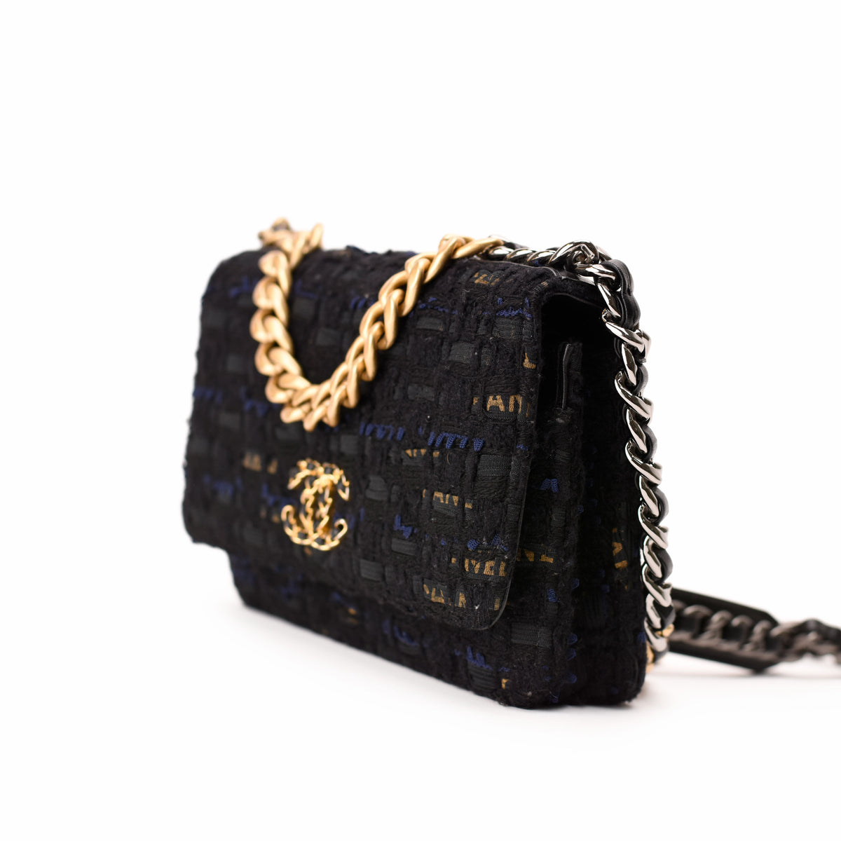 Chanel black tweed flap bag with gold-tone chain strap, curated Pre-loved Luxury by Myluxe in Helsinki.