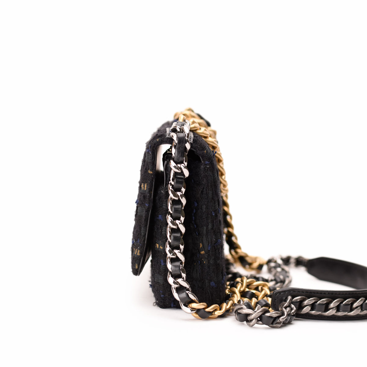 Black textured tweed handbag with gold and silver chain strap, curated Pre-loved Luxury by Myluxe in Helsinki.