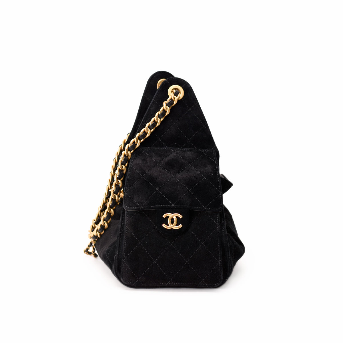 Black quilted suede Chanel handbag with gold chain strap, curated Pre-loved Luxury by Myluxe in Helsinki.