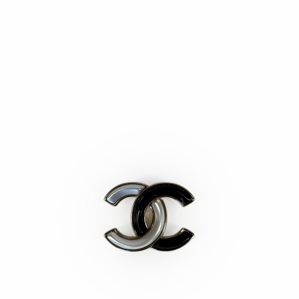 Chanel interlocking CC logo in silver and black metal, curated Pre-loved Luxury by Myluxe in Helsinki.