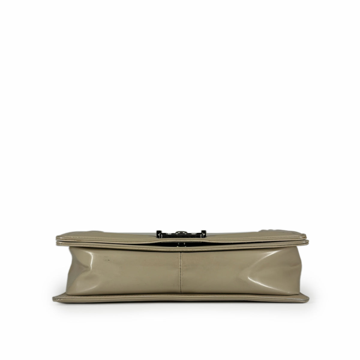 Beige patent leather clutch with silver metal clasp, curated Pre-loved Luxury by Myluxe in Helsinki.