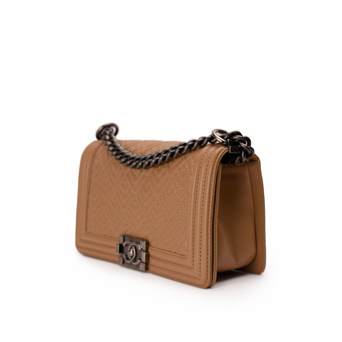 Tan quilted leather handbag with dark metal chain strap, curated Pre-loved Luxury by Myluxe in Helsinki.