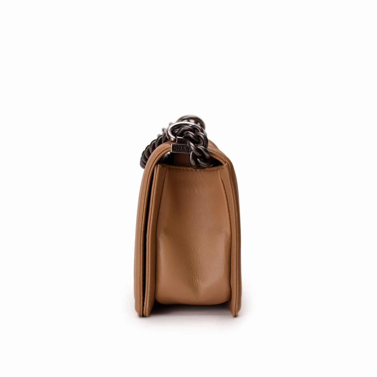 Tan leather Chanel flap bag with silver chain strap, curated Pre-loved Luxury by Myluxe in Helsinki.