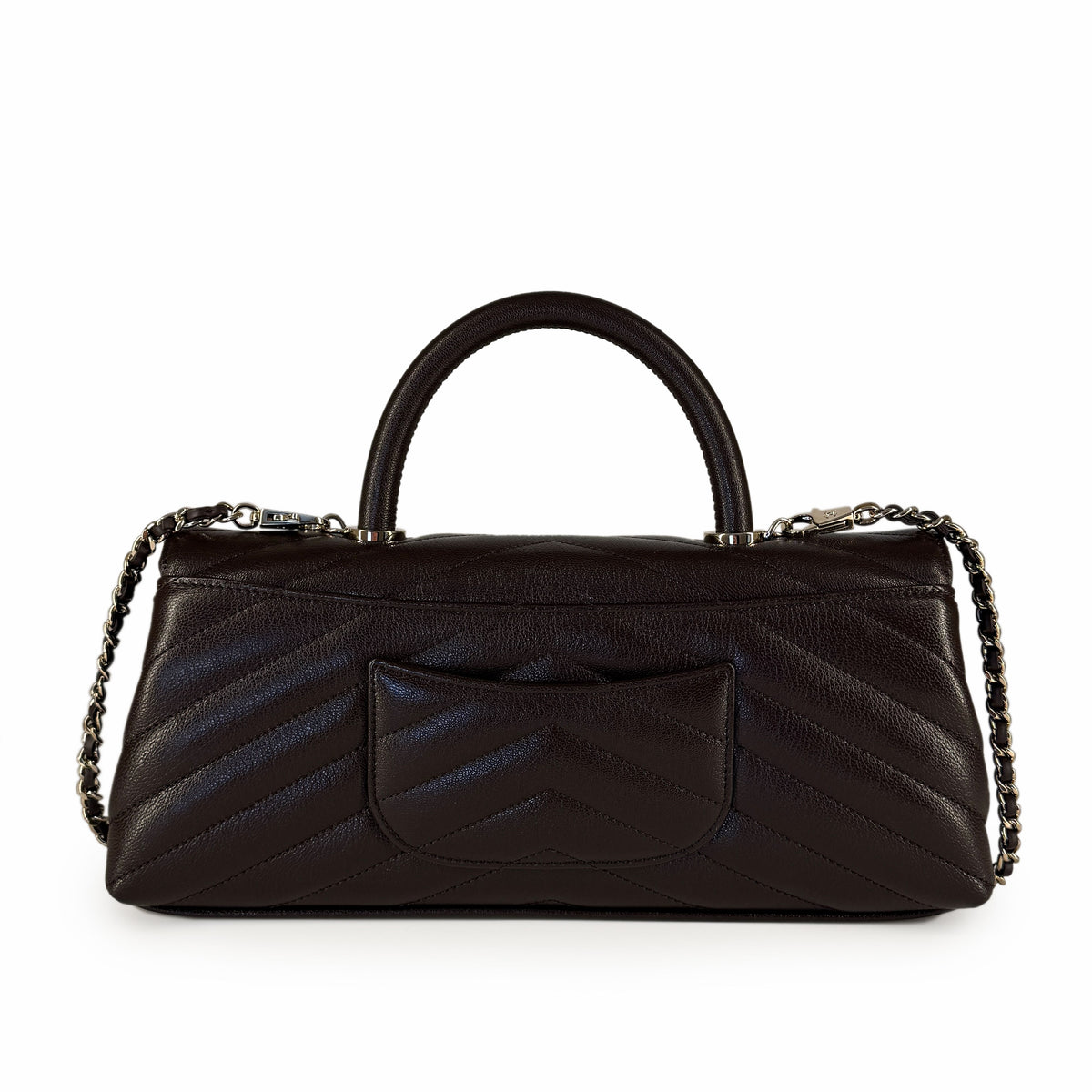 Dark brown quilted leather handbag with silver chain strap, curated Pre-loved Luxury by Myluxe in Helsinki.