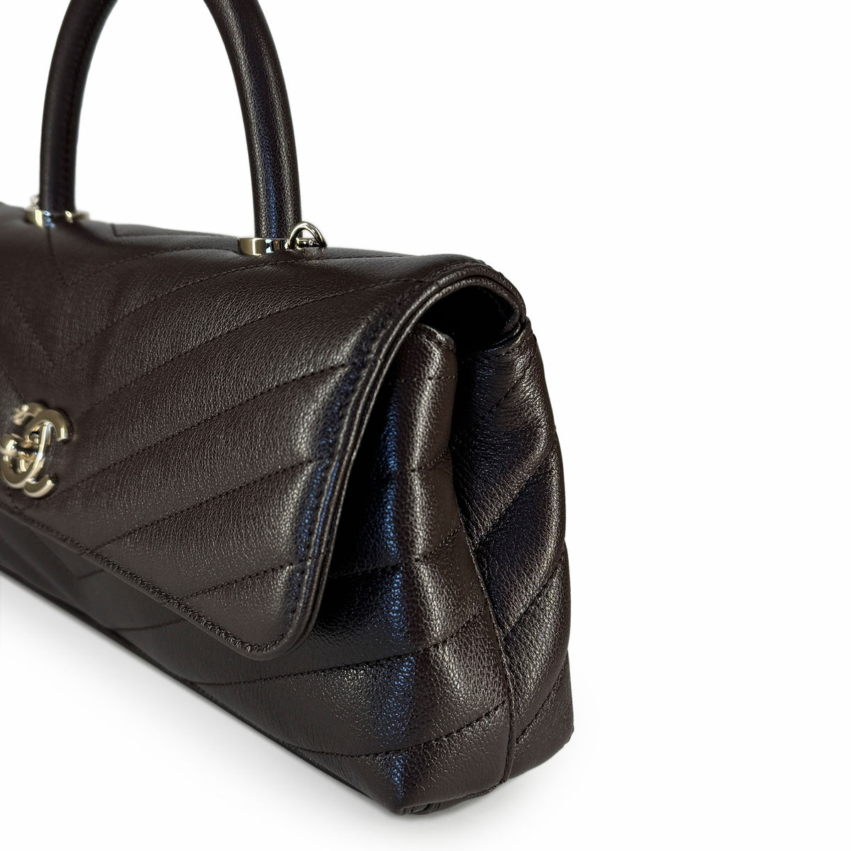 Black quilted leather handbag with silver hardware, curated Pre-loved Luxury by Myluxe in Helsinki.