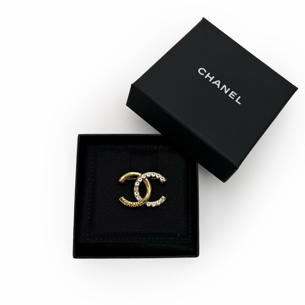 Chanel gold-tone interlocking CC logo brooch with crystal embellishments, curated Pre-loved Luxury by Myluxe in Helsinki.