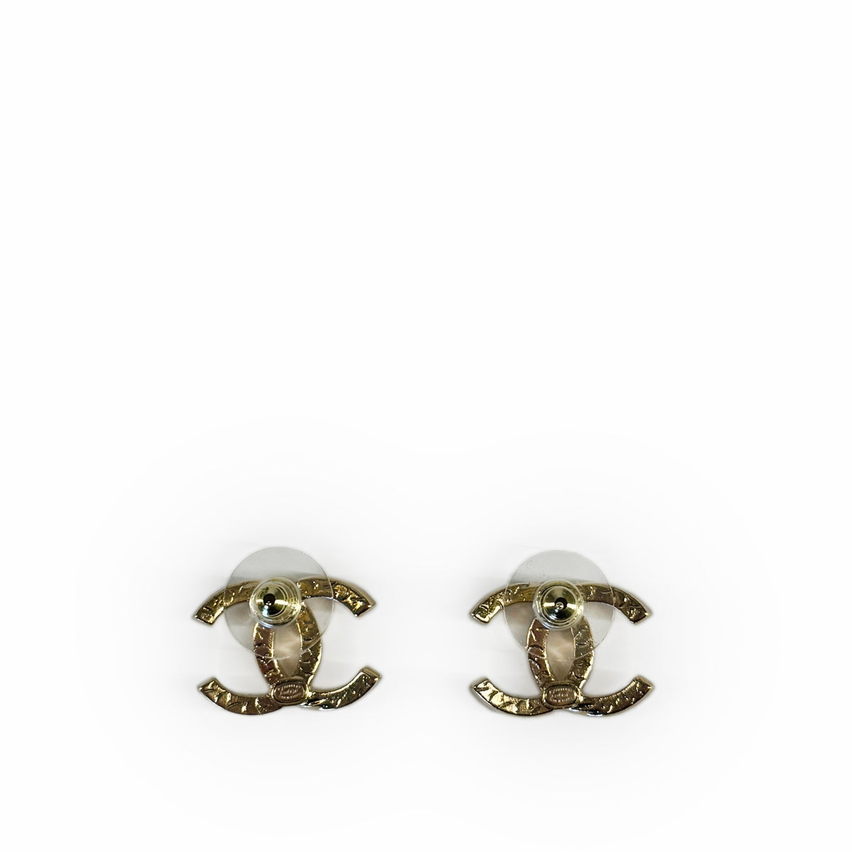Gold Chanel interlocking CC logo stud earrings, curated Pre-loved Luxury by Myluxe in Helsinki.