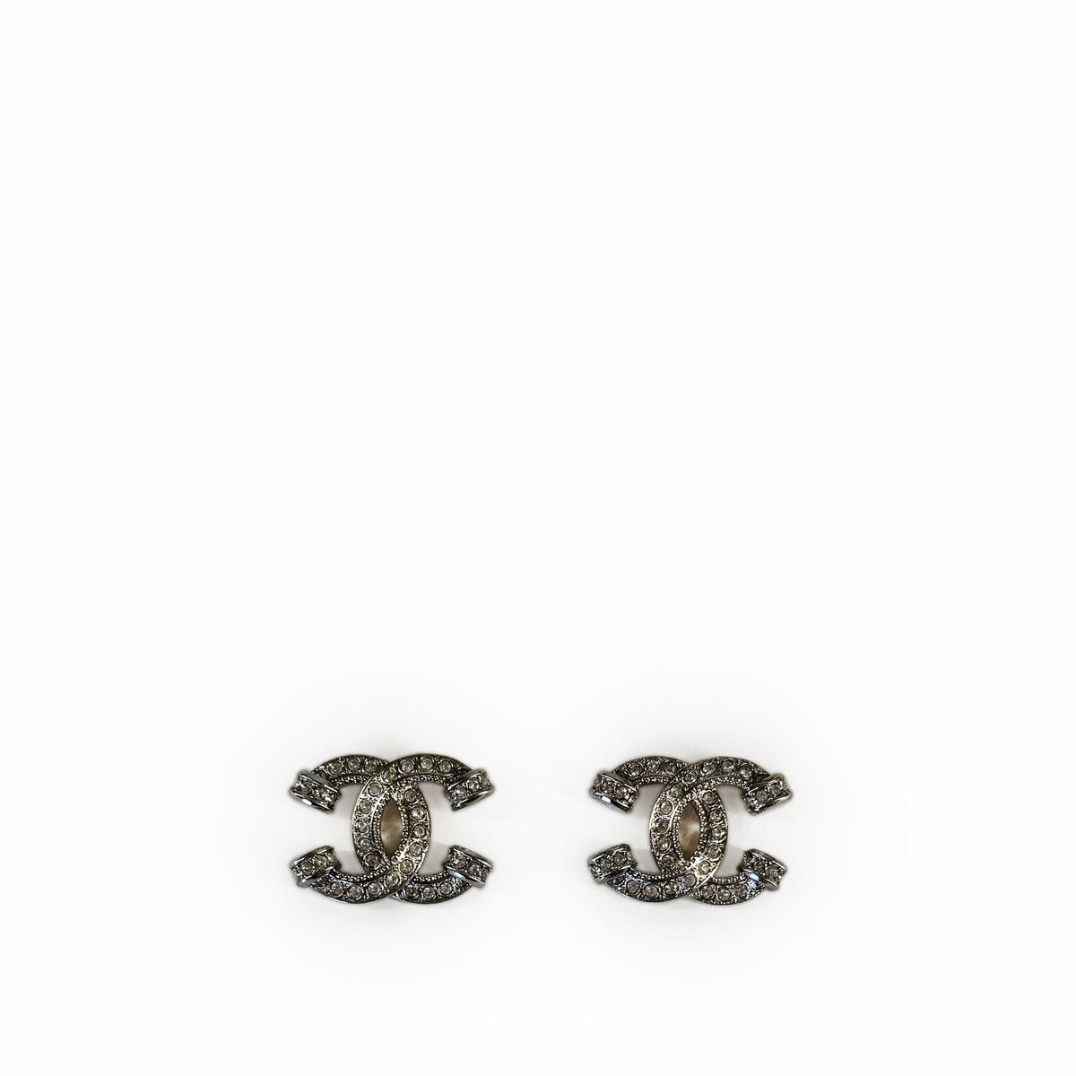 Silver-tone Chanel interlocking CC logo earrings with crystal embellishments, curated Pre-loved Luxury by Myluxe in Helsinki.