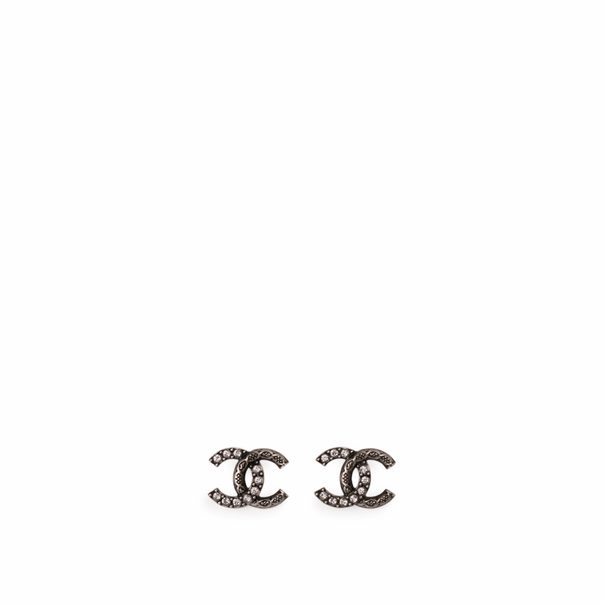 Chanel interlocking CC stud earrings in silver-tone metal with sparkling crystals, curated Pre-loved Luxury by Myluxe in Helsinki.