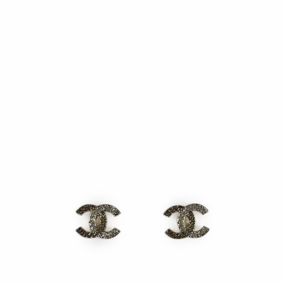 Chanel interlocking CC logo stud earrings in silver-tone crystal, curated Pre-loved Luxury by Myluxe in Helsinki.