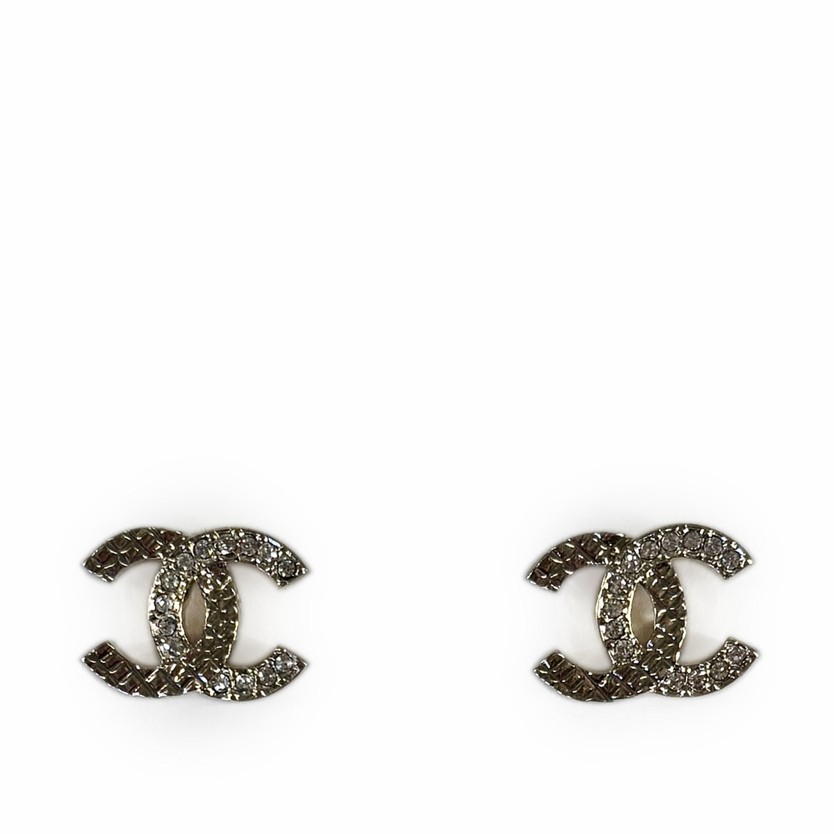 Chanel silver-tone interlocking CC earrings encrusted with sparkling crystals, curated Pre-loved Luxury by Myluxe in Helsinki.