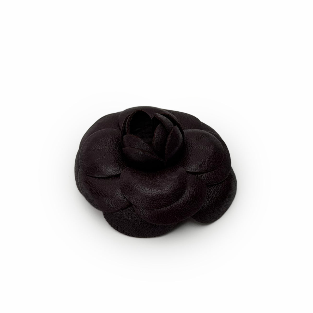 Dark brown leather camellia flower shaped accessory, curated Pre-loved Luxury by Myluxe in Helsinki.