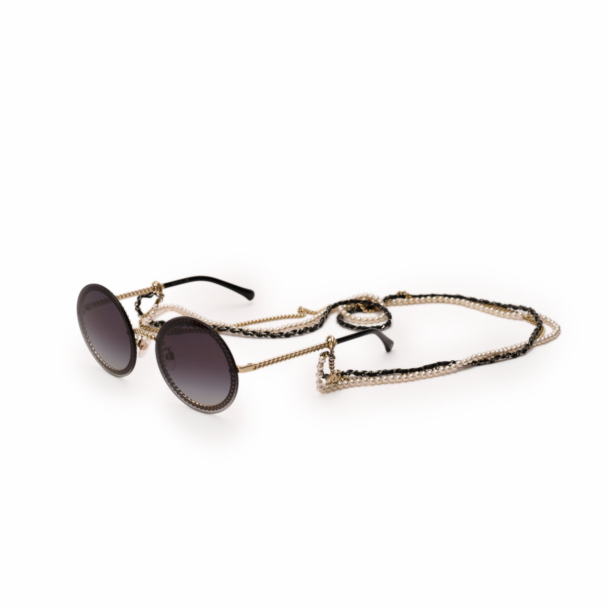 Round black tinted sunglasses with gold-tone metal frames and a pearl and chain strap, curated Pre-loved Luxury by Myluxe in Helsinki.