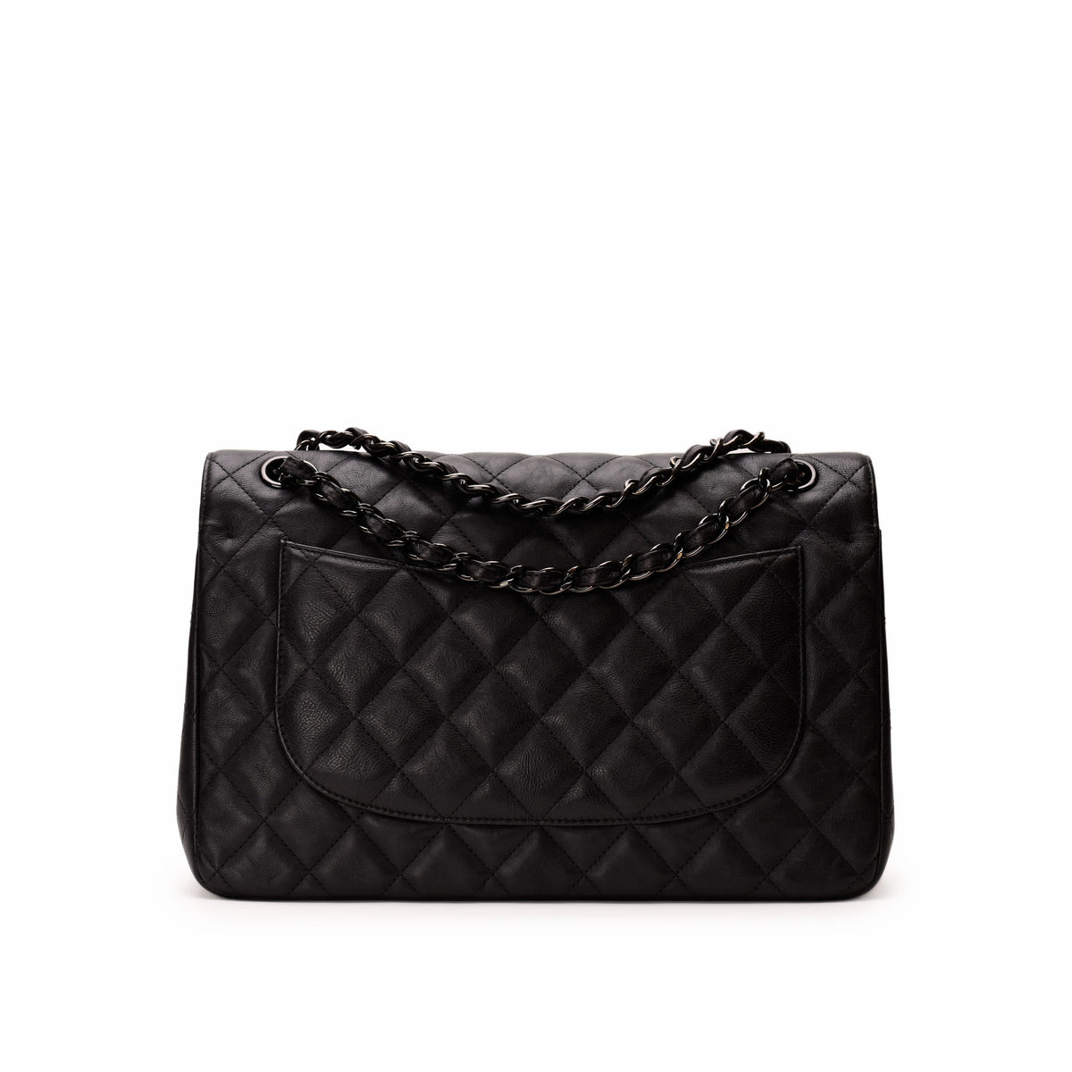 Black quilted leather Chanel shoulder bag with chain strap. curated Pre-loved Luxury by Myluxe in Helsinki.