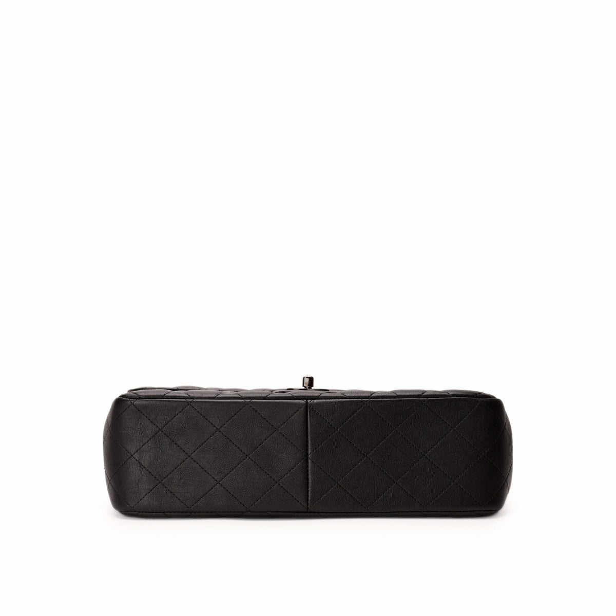 Black quilted leather Chanel clutch bag. Curated Pre-loved Luxury by Myluxe in Helsinki.