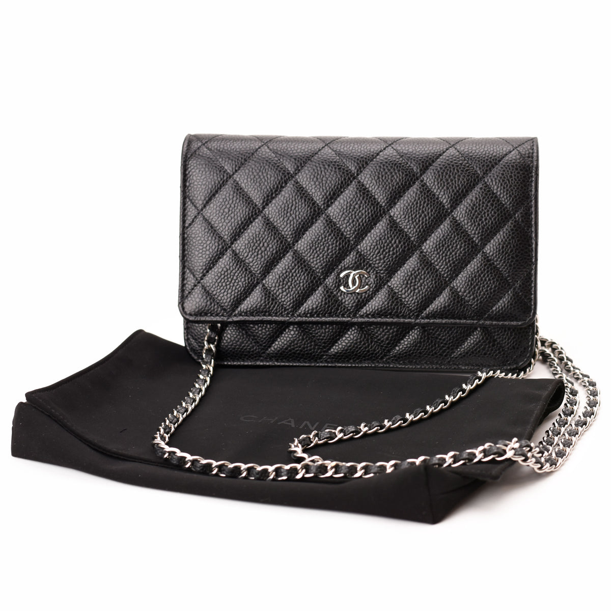 Black quilted leather Chanel shoulder bag with silver-tone chain, curated Pre-loved Luxury by Myluxe in Helsinki.