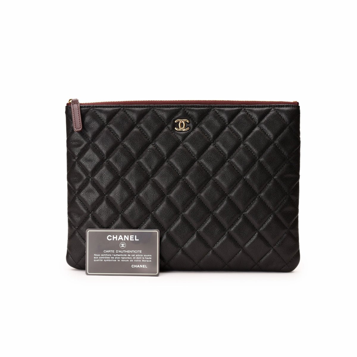 Black quilted caviar leather Chanel clutch bag with gold CC logo. curated Pre-loved Luxury by Myluxe in Helsinki.