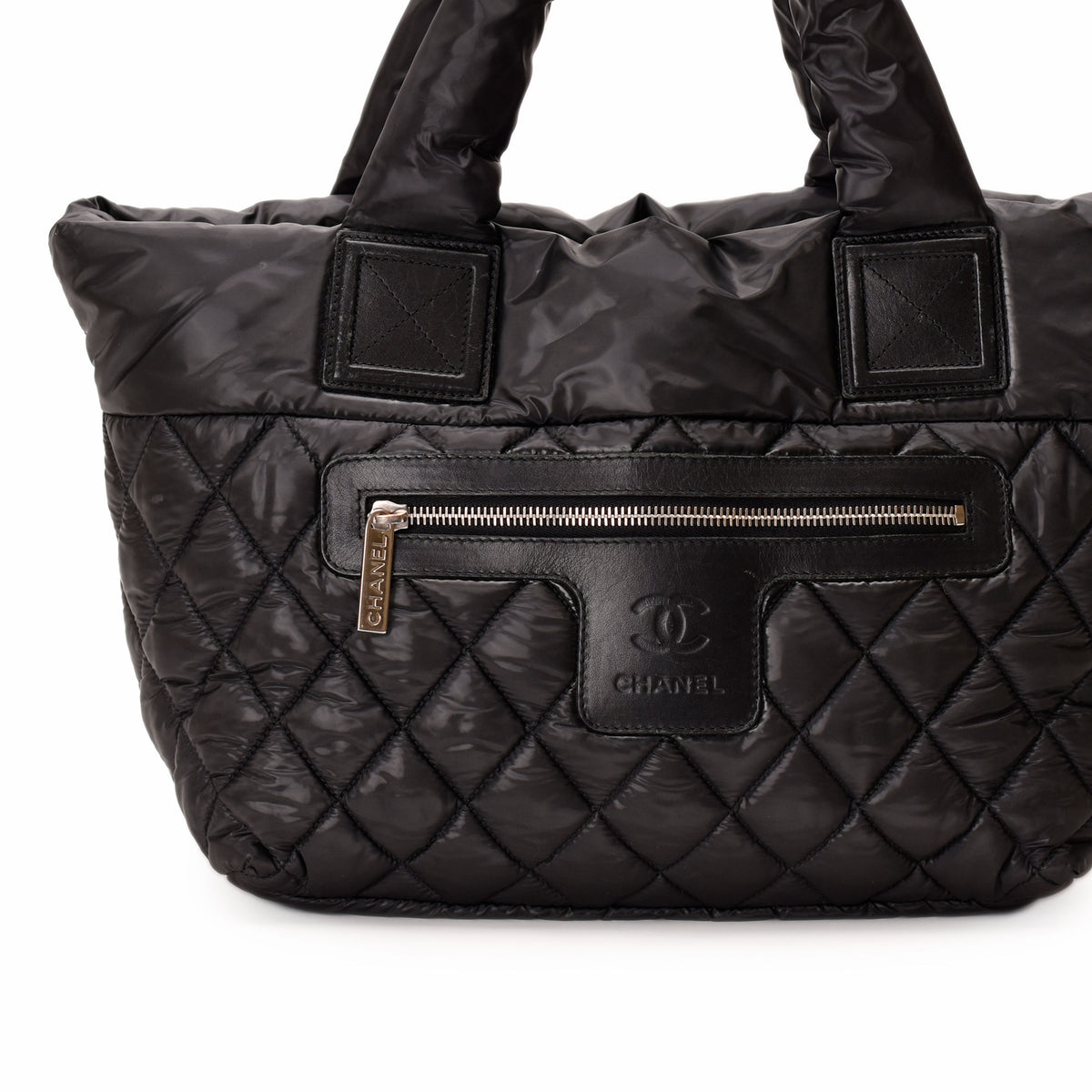 Black quilted nylon Chanel handbag with leather trim, curated Pre-loved Luxury by Myluxe in Helsinki.