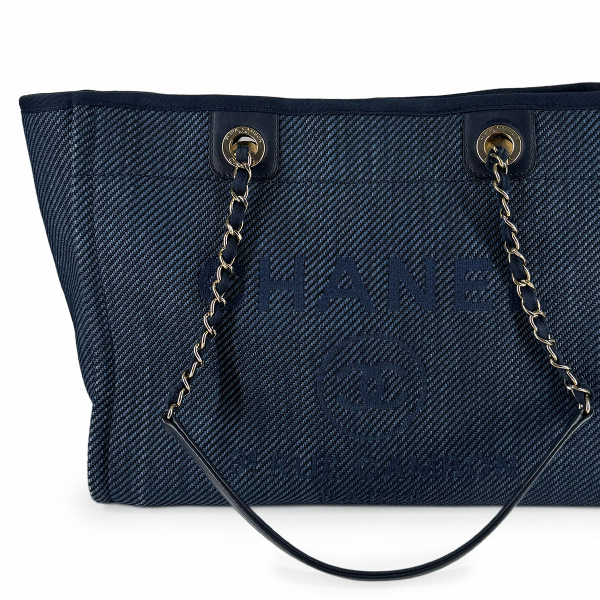 Navy blue canvas tote bag with gold-tone chain handles and embossed logo, curated Pre-loved Luxury by Myluxe in Helsinki.