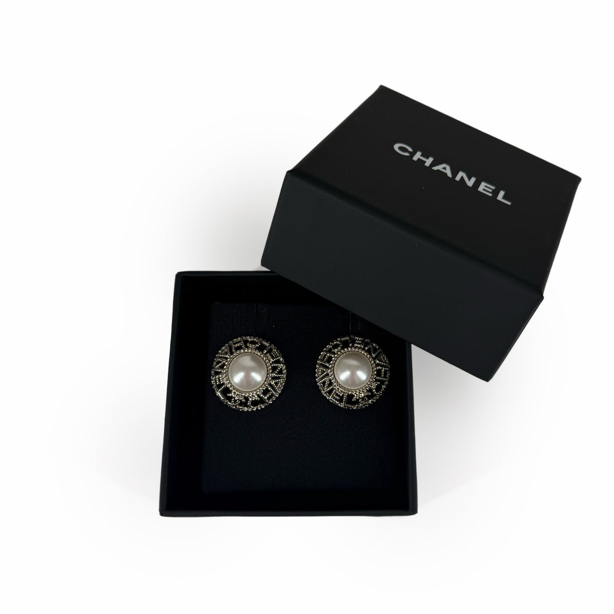 Chanel vintage gold-tone round pearl stud earrings in a black box, curated Pre-loved Luxury by Myluxe in Helsinki.