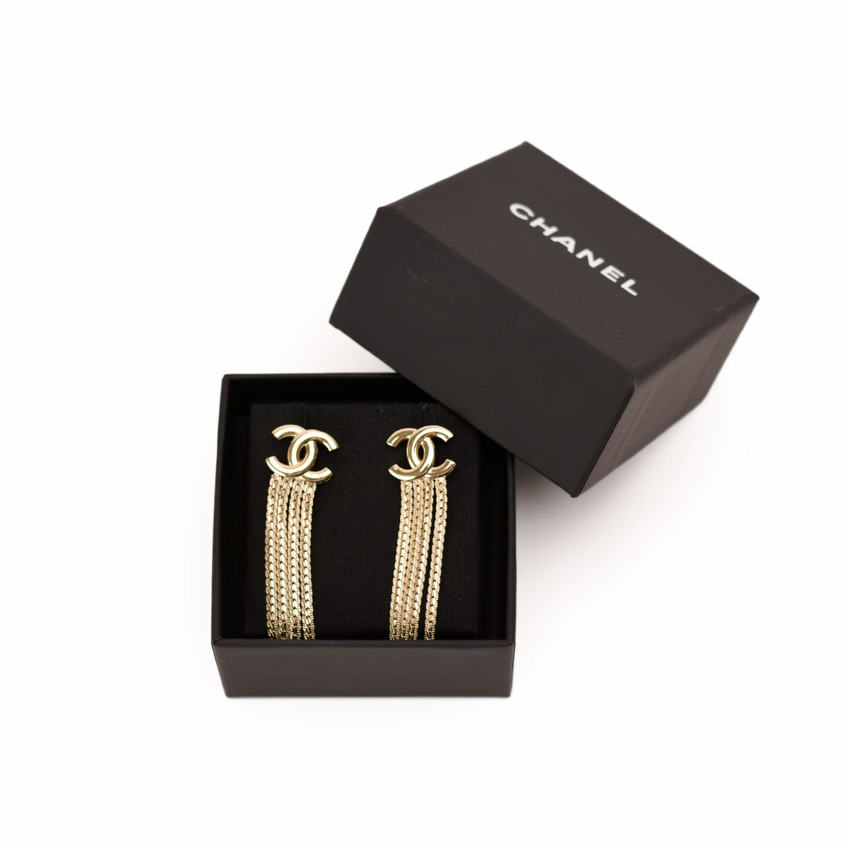 Chanel gold-tone dangling chain earrings in a black box. curated Pre-loved Luxury by Myluxe in Helsinki.