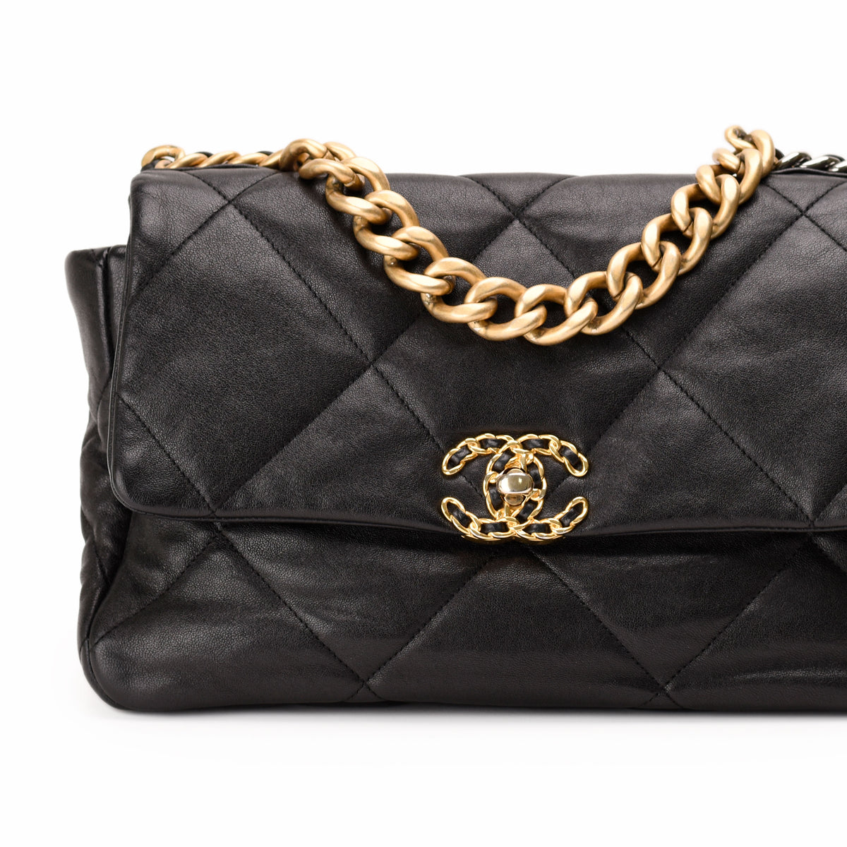 Black quilted lambskin Chanel flap bag with gold-tone chain strap, curated Pre-loved Luxury by Myluxe in Helsinki.