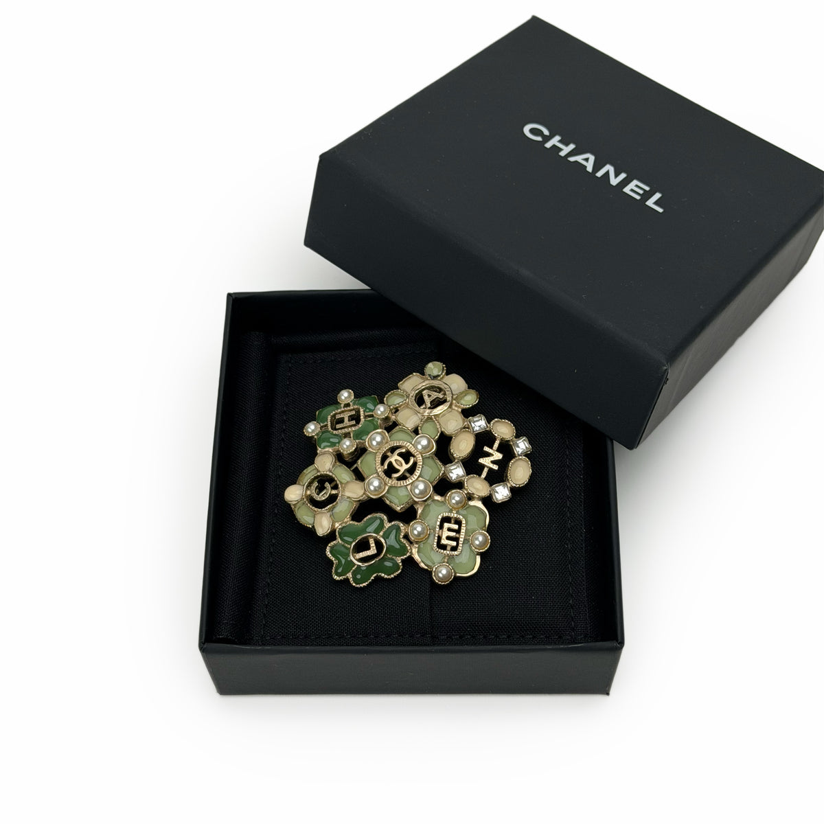 Chanel gold-tone flower enamel brooch with crystal accents, curated Pre-loved Luxury by Myluxe in Helsinki.