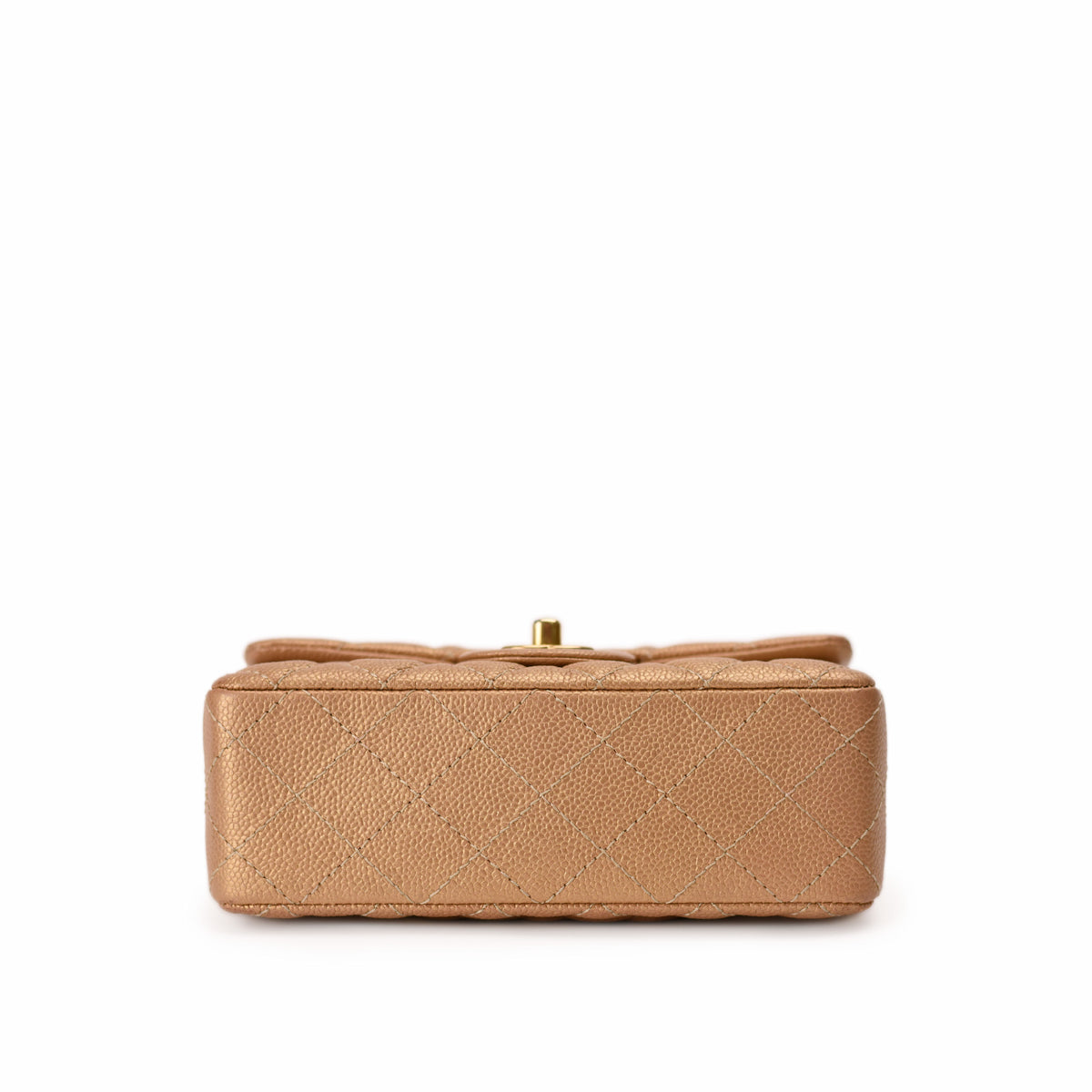 Tan quilted leather Chanel handbag with gold clasp, curated Pre-loved Luxury by Myluxe in Helsinki.