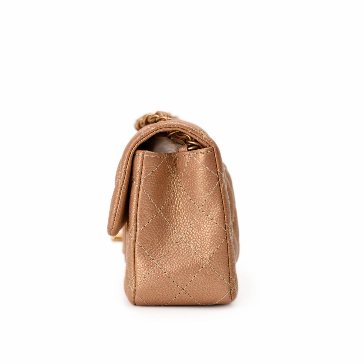 Rose gold quilted leather Chanel handbag with chain strap, curated Pre-loved Luxury by Myluxe in Helsinki.