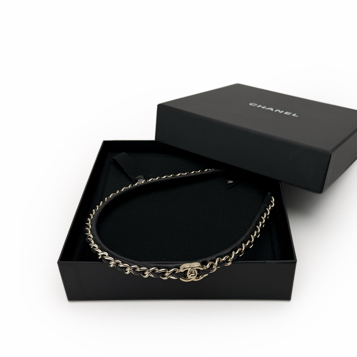 Gold-tone Chanel chain belt in a black designer box, curated Pre-loved Luxury by Myluxe in Helsinki.