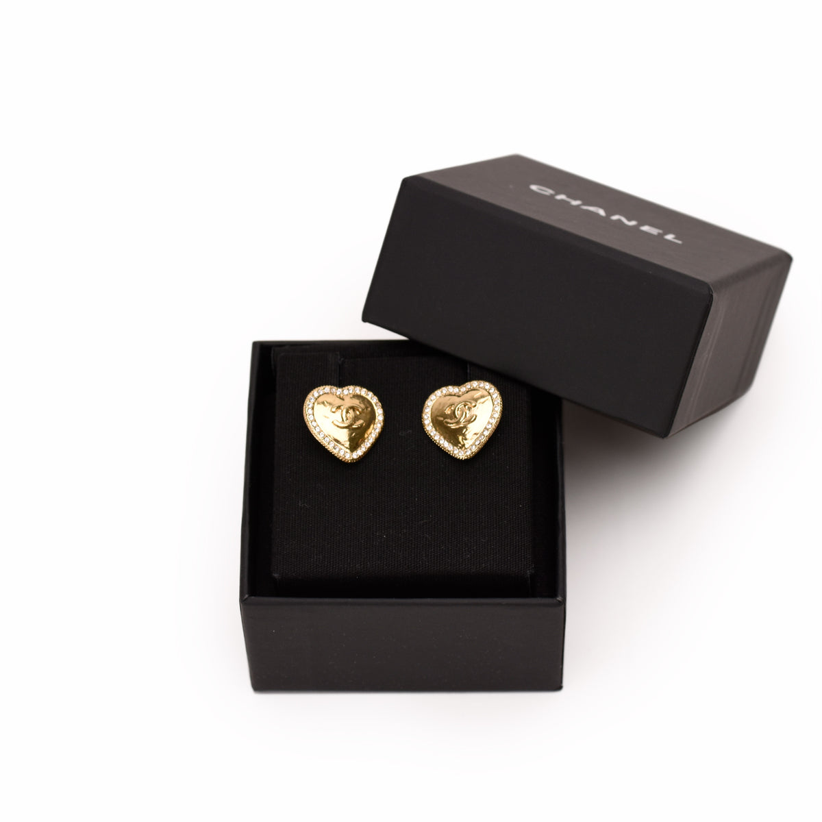 Chanel gold-tone heart-shaped stud earrings with crystal embellishments. curated Pre-loved Luxury by Myluxe in Helsinki.