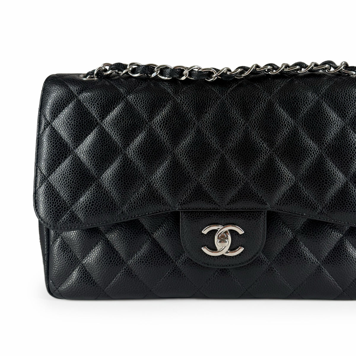 Black quilted caviar leather flap bag with silver-tone interlocking logo, curated Pre-loved Luxury by Myluxe in Helsinki.