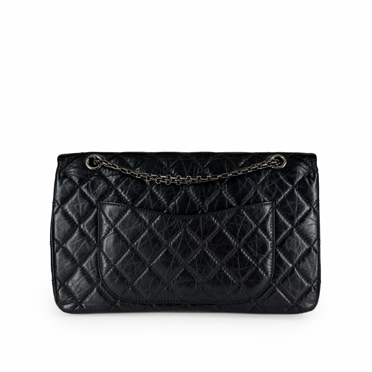 Black quilted leather flap handbag with silver chain strap, curated Pre-loved Luxury by Myluxe in Helsinki.