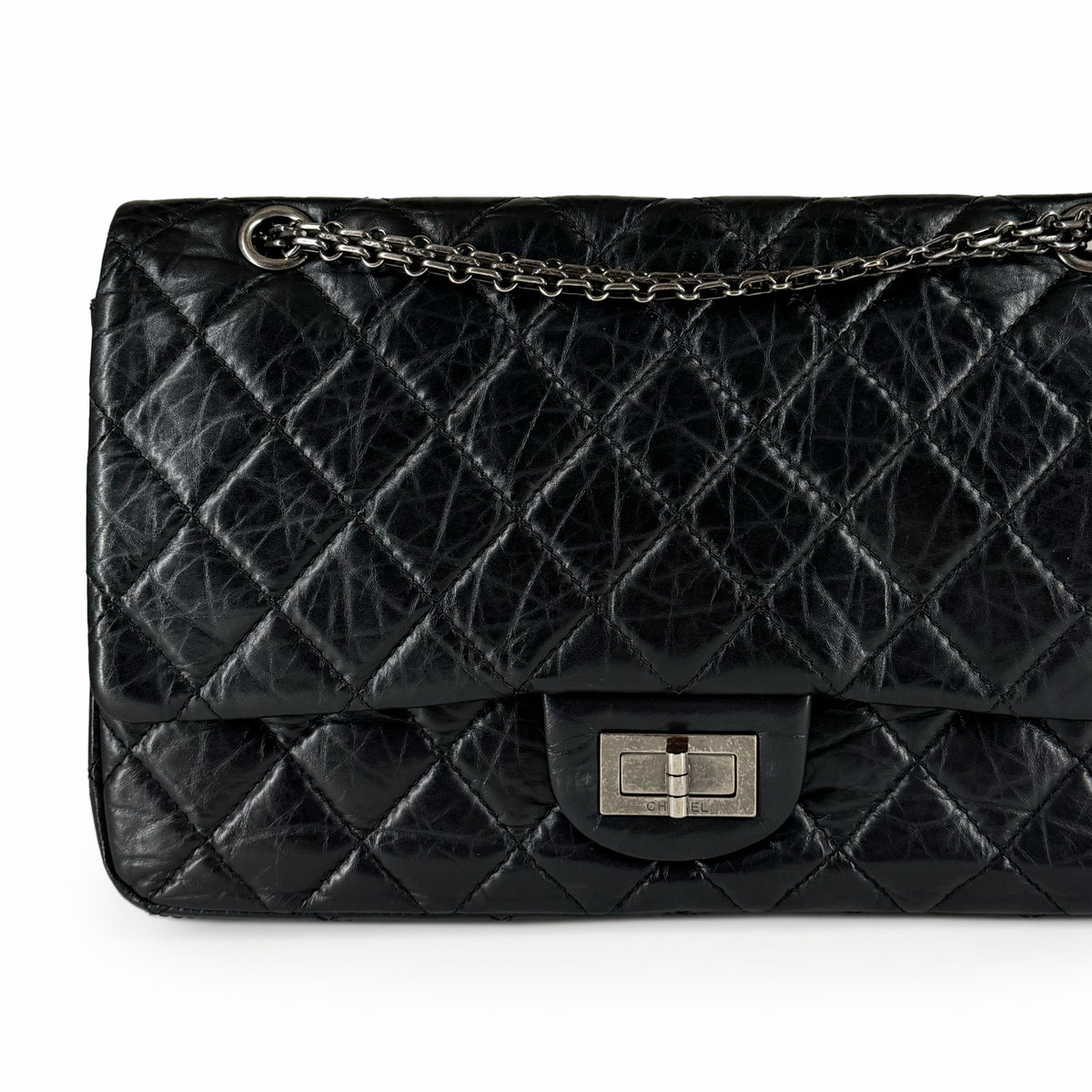 Black quilted lambskin leather flap bag with silver chain strap, curated Pre-loved Luxury by Myluxe in Helsinki.