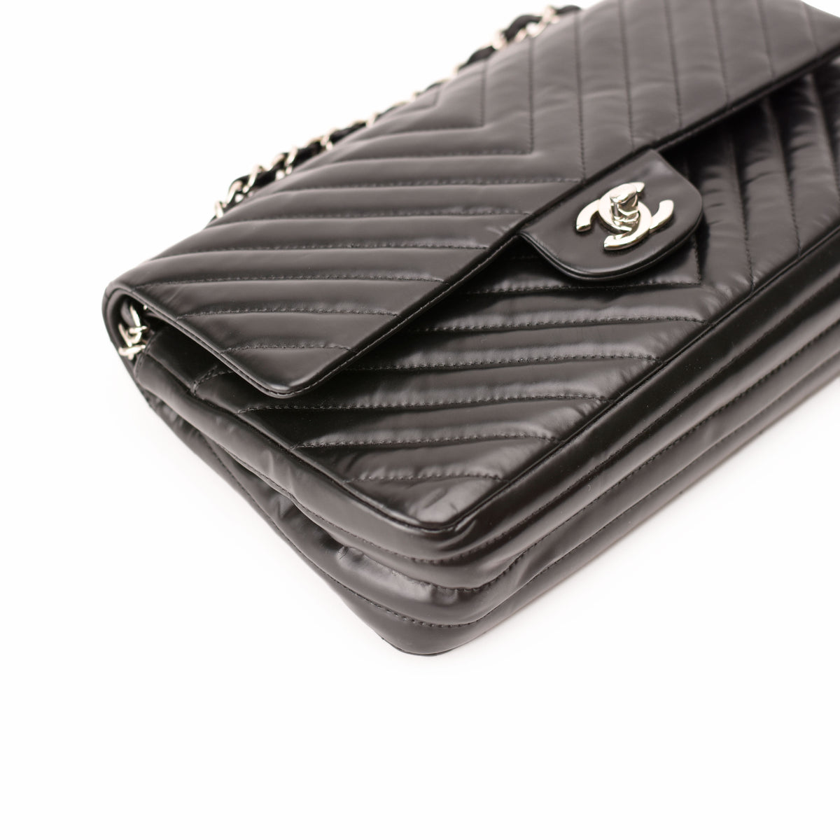 Black quilted lambskin Chanel flap bag with silver CC logo. curated Pre-loved Luxury by Myluxe in Helsinki.