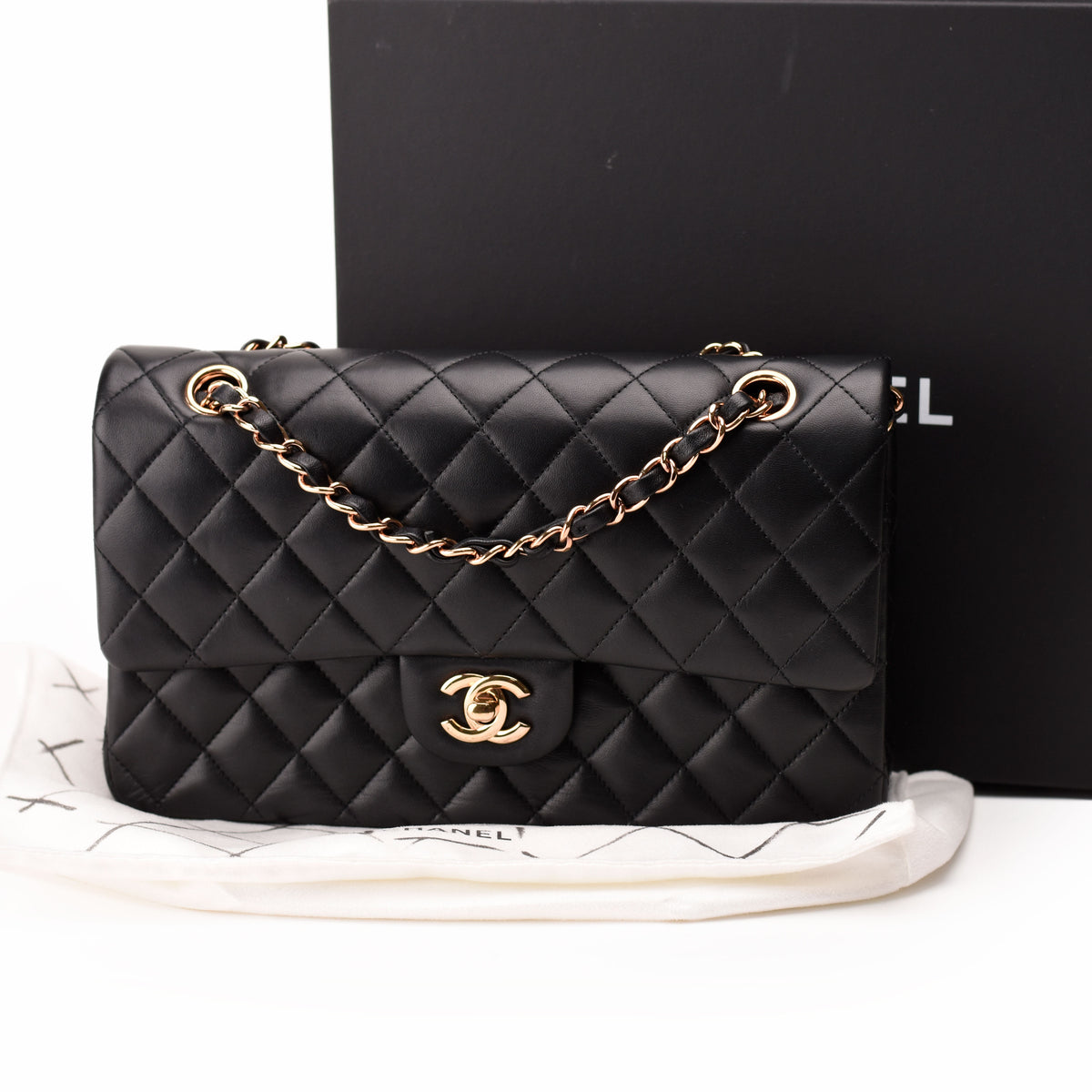 Black quilted lambskin Chanel flap bag with rose-gold-tone chain strap, curated Pre-loved Luxury by Myluxe in Helsinki.