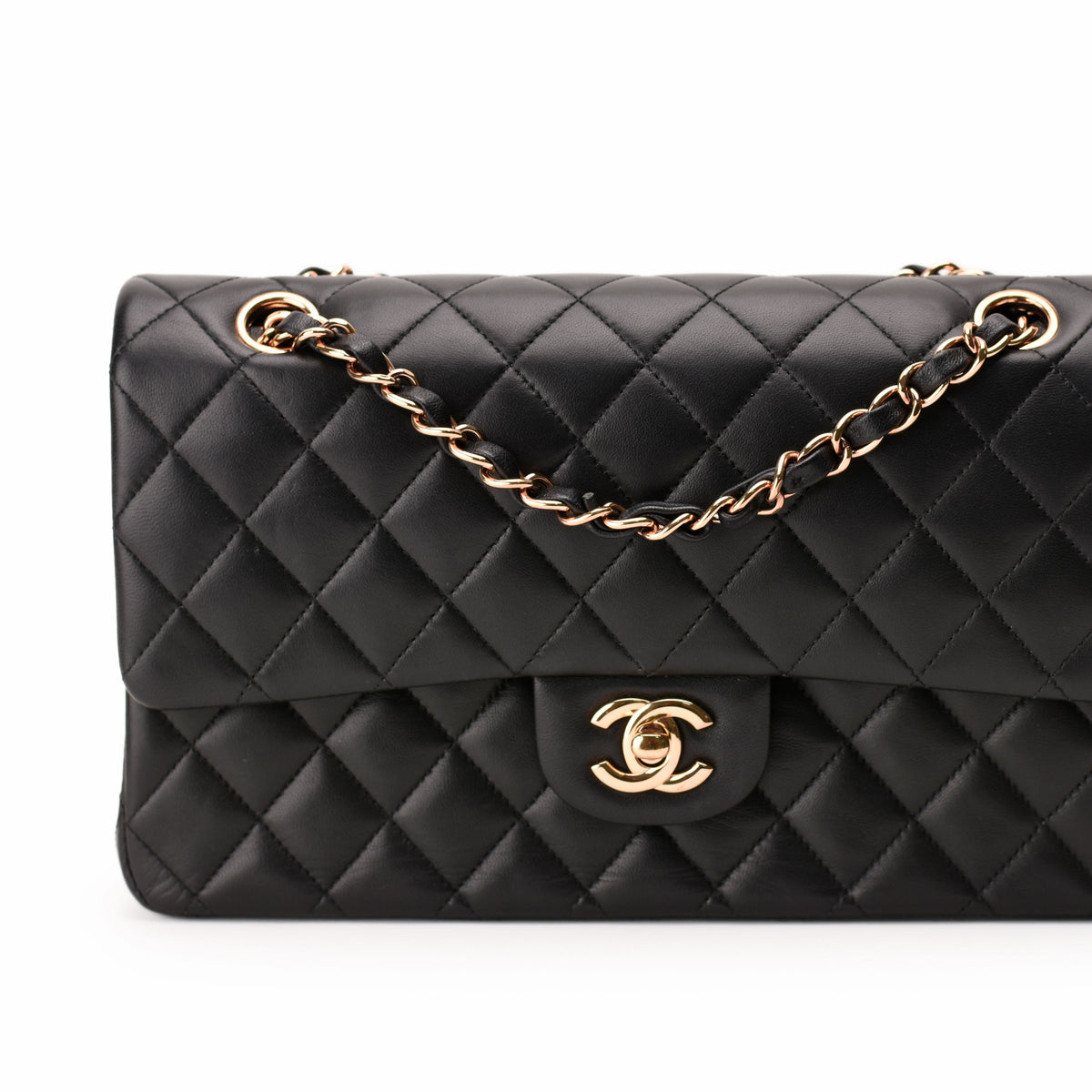 Black quilted leather Chanel flap bag with gold-tone chain strap, curated Pre-loved Luxury by Myluxe in Helsinki.