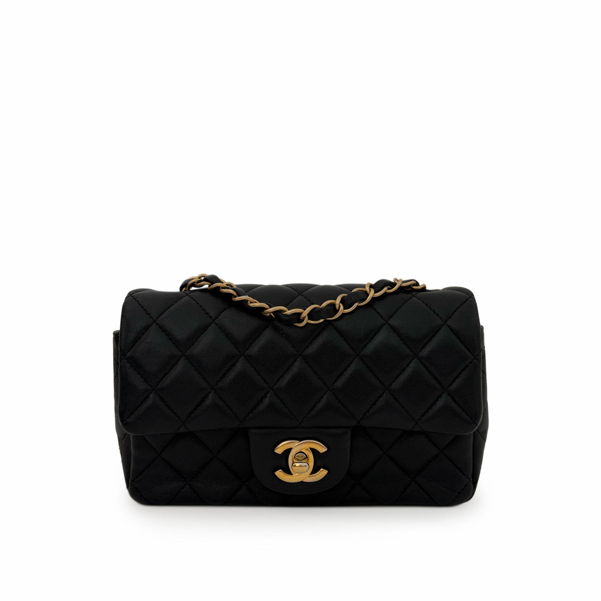 Black quilted leather Chanel flap bag with gold-tone chain and CC hardware, curated Pre-loved Luxury by Myluxe in Helsinki.