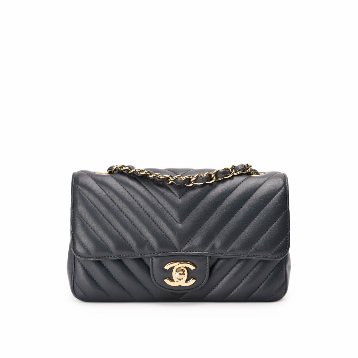 Black quilted leather Chanel flap bag with gold-tone chain strap, curated Pre-loved Luxury by Myluxe in Helsinki.