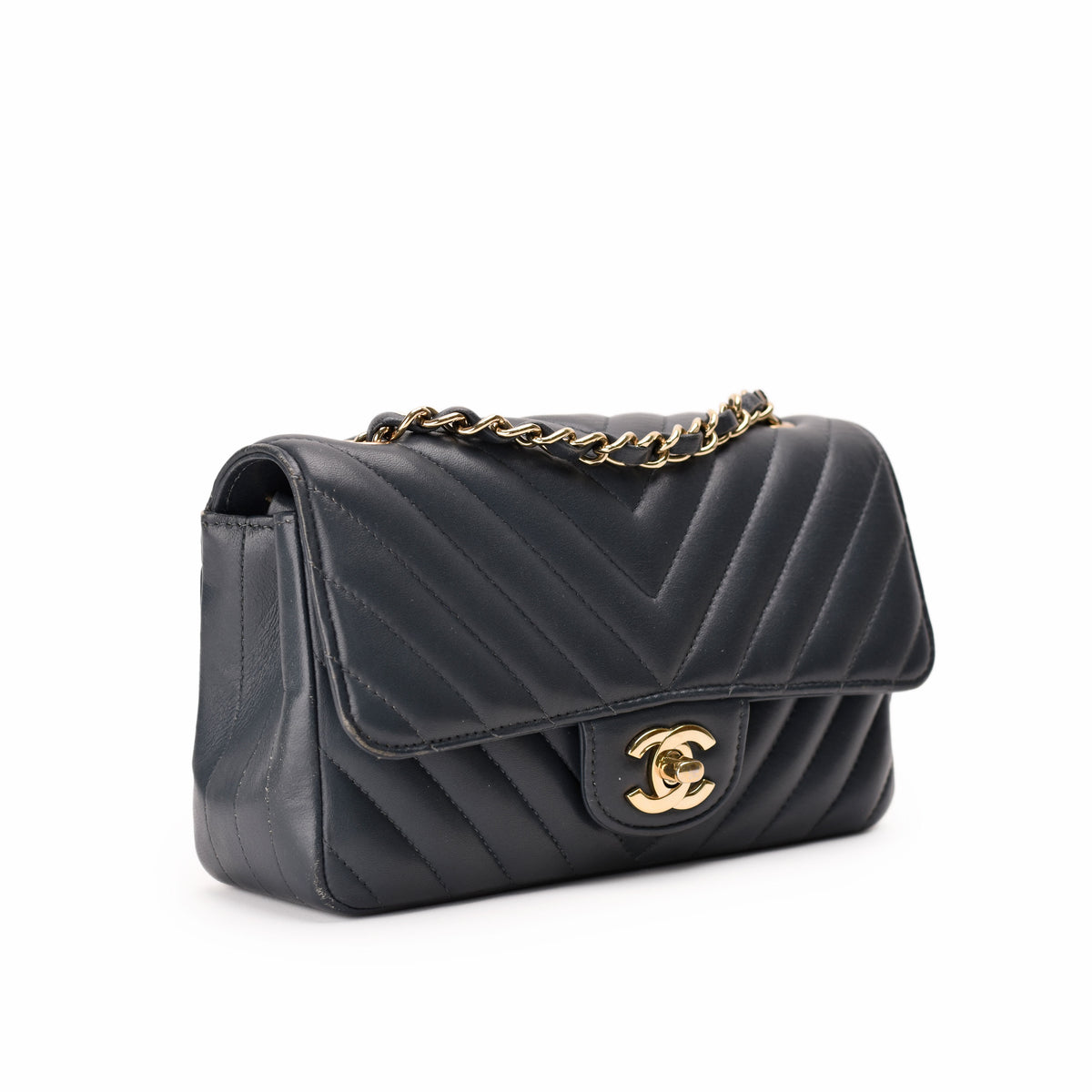 Black quilted leather Chanel flap bag with gold chain strap, curated Pre-loved Luxury by Myluxe in Helsinki.