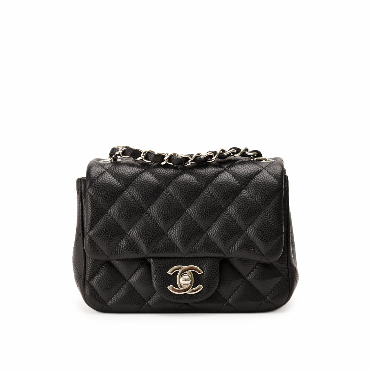 Black quilted caviar leather Chanel flap bag with silver chain strap, curated Pre-loved Luxury by Myluxe in Helsinki.